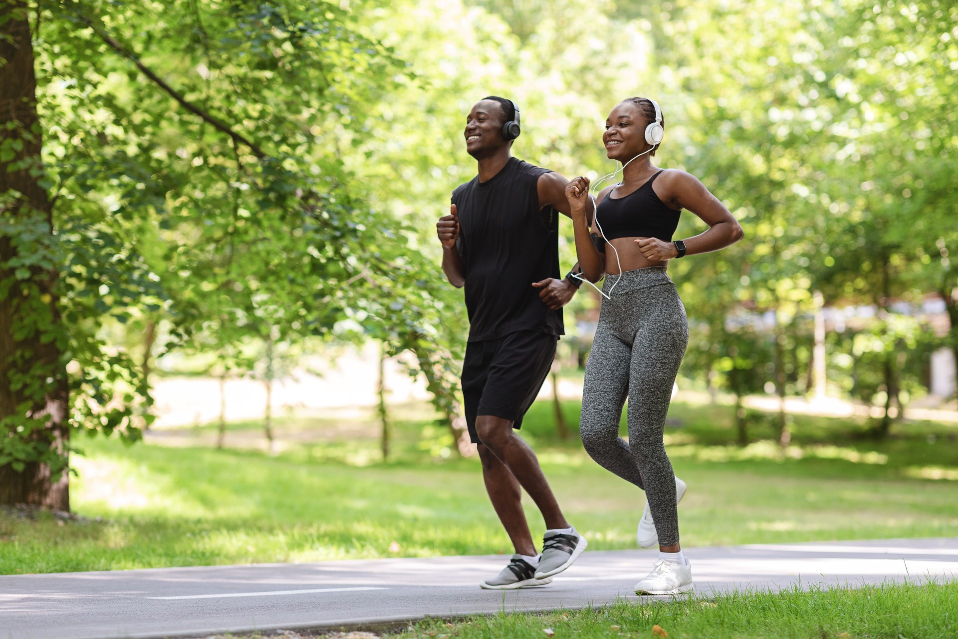 Morning Run. Sporty Black Guy And Girl Jogging Together In Green Park